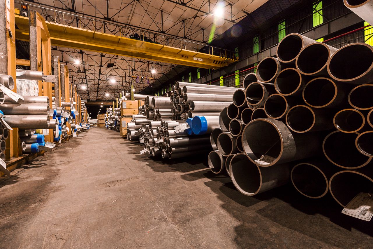 Steel pipes arranged inside a manufacturing facility